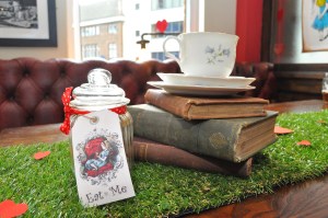 Table centrpiece with vintage books for an alice in wonderland party