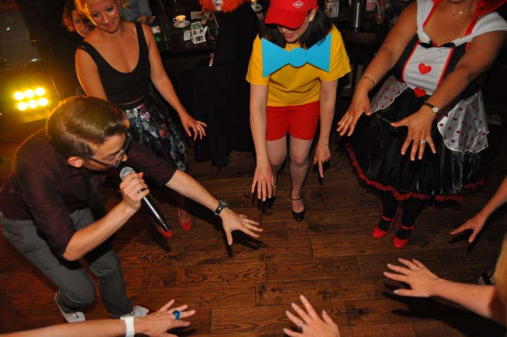 Dancing time at an alice in wonderland themed birthday party 